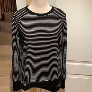 DANSKIN. tunic top features a long sleeve scoop neck pullover sweatshirt…